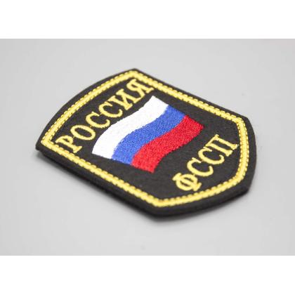 Где купить Шеврон вышитый РОССИЯ ФССП, черное поле нить(шелк) с липучкой в Москве недорого с доставкой по России