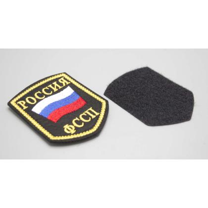 Где купить Шеврон вышитый РОССИЯ ФССП, черное поле нить(шелк) с липучкой в Москве недорого с доставкой по России