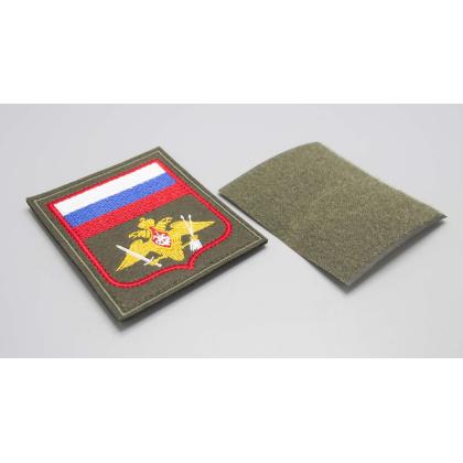 Где купить Шеврон вышитый РВСН (с флагом РФ) оливковый фон (на липучке) приказ № 300 от 22.06.2015 в Москве недорого с доставкой по России