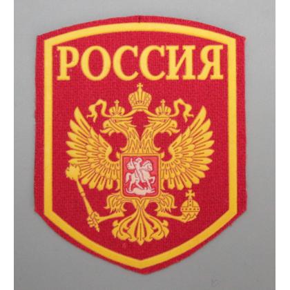 Где купить Шеврон пластизолевый Россия (5-уг. с гербом) красн.  военторг Атаман Москва доставка дешево