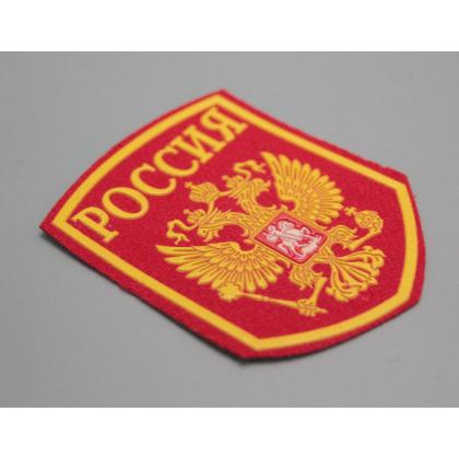 Где купить Шеврон пластизолевый Россия (5-уг. с гербом) красн.  военторг Атаман Москва доставка дешево