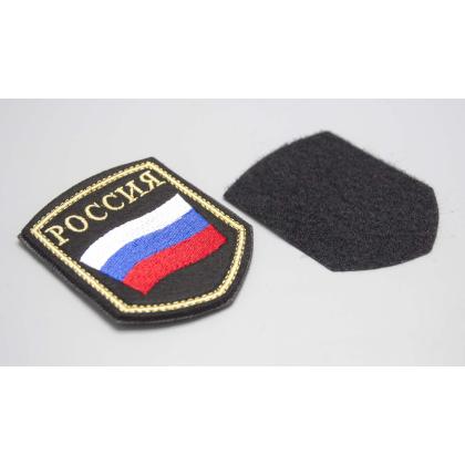 Где купить Шеврон вышитый РОССИЯ (флаг), черное поле нить(металл золото) с липучкой в Москве недорого с доставкой по России